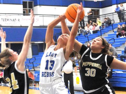 Fannin County’s Becca Ledford is fouled as she goes up for a layup against Pepperell Wednesday, January 19, at Fannin High.