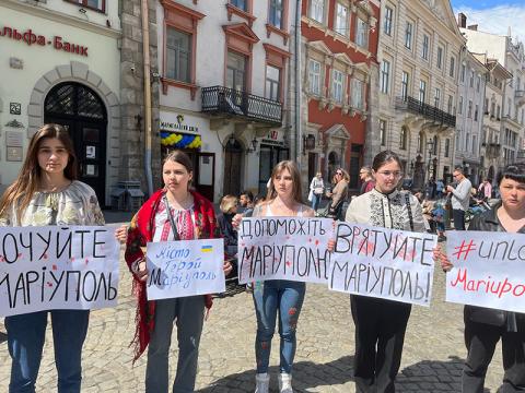 This group of young girls in Mariupol hold signs asking that their city be protected from the invading Russian forces.