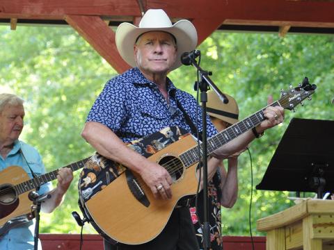 This gentleman rocked a cowboy hat and acoustic guitar during Pickin’ in the Park last Thursday night, July 14, at Ron Henry Horseshoe Bend just outside McCaysville. The weekly event, which is sponsored by the Fannin County Recreation Department, features a variety of instruments, none of which can be electric. The event will continue every Thursday night through September.