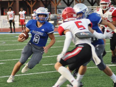 Senior quarterback Corbin Davenport (8) runs the ball during the second quarter in the preseason scrimmage against Stephens County High School Friday, August 12.
