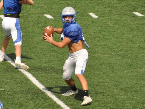 Senior Corbin Davenport winds up to throw a pass in practice last week as he prepares for the Rebels’ scrimmage Friday night against Stephens County.