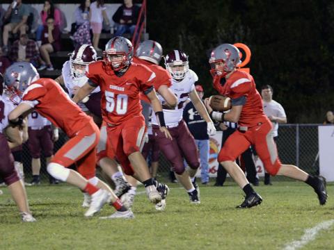 Avery Crowder (6) runs the ball while Zach Beech (50) clears his path in the Copper Basin Cougars match up against Tellico Plains High School Friday, September 23. Copper Basin celebrated Homecoming at halftime of the game with the Bears. Kait Kraft was crowned Homecoming Queen and Maddie Cribbs was crowned Homecoming Princess. Their picture appears elsewhere in today’s newspaper.