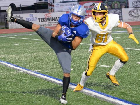 Senior Bryson Holloway secures a catch for Fannin County in recent action for the Rebels football team. The Rebels secured their first region win this past Friday night when they traveled to Gordon Central High School in Calhoun.