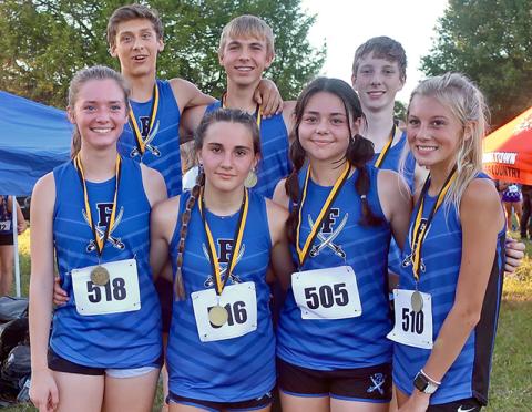 Medalists from the Rockmart Invitational smile after thier race. Shown are, from left front, Olivia Temples, Karli Sams, Kristin Cipich and Lindsey Holloway; and back, Benjamin Bloch, Gavin Davis and Luke Callihan. 