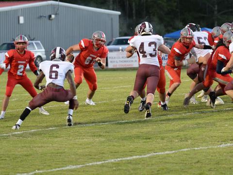 Addison Hook (61) runs the ball as Isaac Deal (7) clears a path with a block in recent action for the Copper Basin Cougars football team.