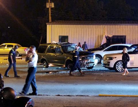 This was the scene at approximately 10:30 Friday night in Copperhill after the Ford SUV in the center of the picture crashed into and then went through the building in the backgrouond at the end of Ferry Street. The building, located not far from the back of the former New York Restaurant, reportedly belongs to Dr. Richard Tanner. Official reports were not available Monday due to the Columbus Day Holiday.