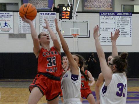 Riley Hall (32) goes for two points for the Copper Basin Lady Cougars in their matchup against Gilmer County in the first round of the ETC tournament in Ellijay Saturday.