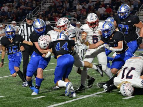 Braden Taylor (10), Nate Maloof (63), Clay Heaton (44), Cooper Born (14) and Logan Long (77) work hard on defense in the Thursday night’s matchup against Haralson County.  