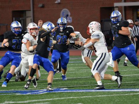 Jeremy Tammen (71), Cooper Hilliard (5), Jacob Dye (60) and Logan Long (77) sets their sights on the ball carrier in recent action for the Rebels. They will travel to Callaway to face the Cavaliers Friday, November 18. 