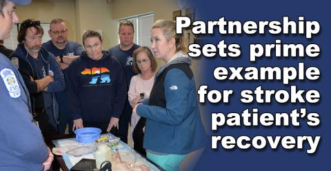 Elizabeth Lynch, right, demonstrates the new technology at Kennestone Hospital that helped heal a Fannin County stroke patient. Fannin County Emergency Medical Service employees watching the demonstration are, from left, Michael Schuhle, Eric Sowers, Brian Herndon, Carolyn McLinden, Clinton Hughes, and Becky Callihan.