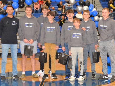 The 8th Grade Rebels basketball players were recognized at halftime of the Fannin County High School Lady Rebels basketball game Friday, January 20. The 8th grade team earned the title of MAC Runner Ups and the 7th grade team won the MAC Championship. Shown are, from left, Head Coach Jeff Daves, Keaton Watkins, Kolton Kaylor, Camden Wolsey, Kylan Dover, Kole Foster, Rylan Davis and Assistant Coach Lucas Walden.
