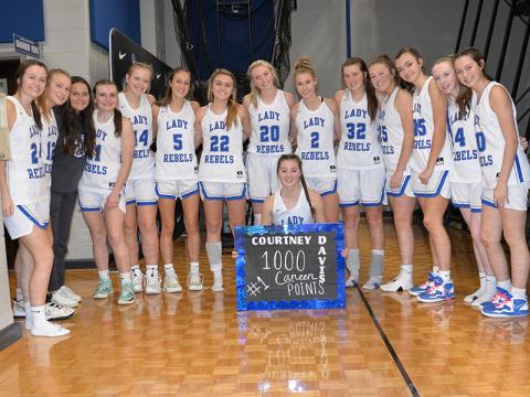 Fannin County Lady Rebel Junior Courtney Davis, kneeling, celebrates her 1,000th career point with her teammates after the game against Elbert County Saturday, January 7. Shown are, from left, Jayden Bailey, Callie Ensley, Eugenia Garcia, Maggie Ledford, Emma Holloway, Reigan O’Neal, Riley Reeves, Ava Queen, Ellie Cook, Macy Hawkins, Addison Smith, Reese Lewis, Emma Buchanan and Avi Ethington.