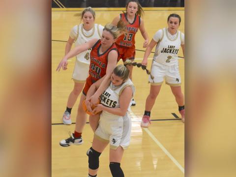 Lady Cougar Cora Kimsey (00) battles for a rebound and Kendra Deal (13) waits for the outcome in recent Copper Basin basketball action. 