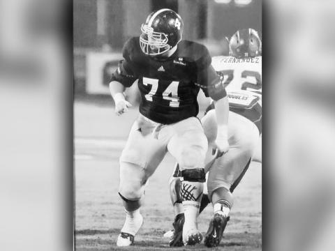 Logan Daves pictured in action at Georgia Southern University during his collegiate football career as an offensive lineman.  