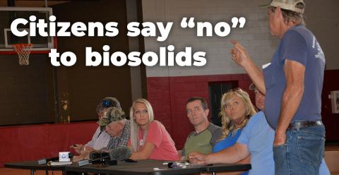 Rick Boring, standing, makes a point to Polk County commissioners, from left, Samantha Trantham, Keith Barker, Kelley Morgan and Greg Brooks during the town hall meeting Saturday at Copper Basin Elementary School. Boring reminded the crowd how a previous group had attempted to use the former industrial and mining sites in Copperhill as a landfill.
