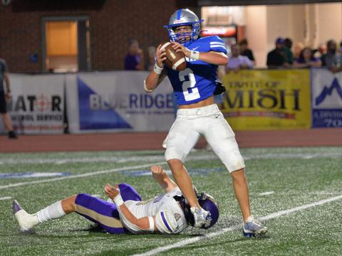 Fannin County’s Lawson Sullivan (2) sets up to throw as he escapes the clutches of a Union County defender Thursday night in Blue Ridge.