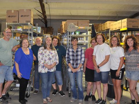 Fannin County Family Connection staff and volunteers shown in the food pantry storeroom are, from left, John Jacobs (Family Care program director), Sherry Morris (executive director), Mandi Hyde (Director of Administration), Priscilla McDonald (volunteer), Michelle Kellogg (volunteer), Karen Walton (volunteer), Kathy Jones (volunteer), Kala Ballew (Food Pantry manager), and Diane Treadway (visiting volunteer). 