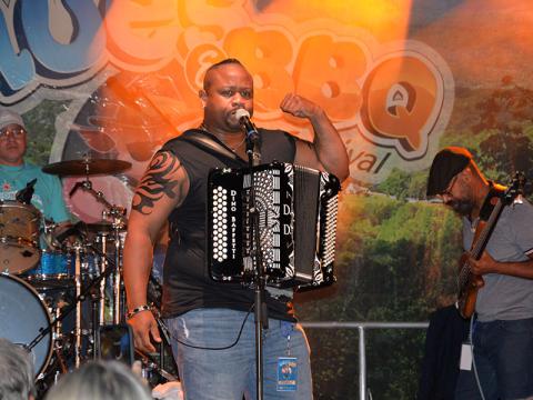 Dewayne Dopsie of Dewayne Dopsie and the Hellraisers electrified the Blues & BBQ crowd in Blue Ridge Saturday night. It was the group’s third time appearing at the event, which marked its 12th anniversary this year. Despite rain most of the day, the sky held back for the last performances and the traditional huge crowd was on hand to end the day.  