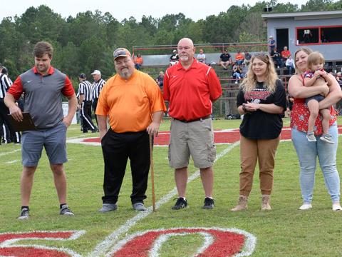 Mike Hamby was honored as the newly formed Copper Basin Alumni Association’s first Legend of the Game Friday night prior to the Cougars game with South Pittsburg. Shown during the recognition ceremony are, from left, Dylan Boggs, Hamby, John Spargo, Hamby’s daughters Lindsey and Lauren, and granddaughter Maeve Guzman.