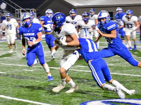 Elijah Weaver (11), CJ Reece (23) and Luke Holsonback work to bring down a Model runner in Fannin Couny’s Region 7AA matchup with the visitors Friday night in Blue Ridge.