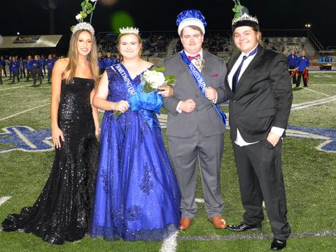 Katlin Jarrett, second from left, was crowned Fannin County High School’s Homecoming Queen Friday night during halftime of the Rebels’ Region 7-AA contest with Model and Ridge Stevens, second from right, was crowned king. Last year’s queen, Reigan O’Neal, crowned her successor and Stevens was crowned by Judd Watson.