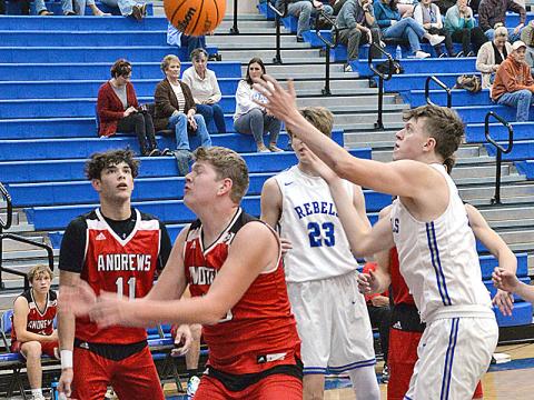 Isaiah Angel reaches for a loose ball during the Fannin County High School Rebels scrimmage against visiting Andrews High School last Wednesday night. The Rebels won the contest 64-53.