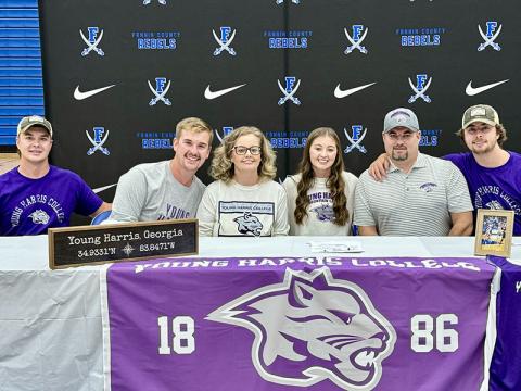 Courtney Davis, fourth from left, has signed her letter of intent to play basketball for Young Harris College. Shown during the official signing ceremony are, from left, Will Davis, Logan Davis, Christal Davis, Davis, Vincent Davis and Jackson Davis.