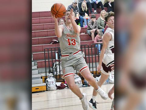 Carder Lance goes for two points for the Copper Basin Cougars. He led the Cougars with 16 points in their win over the Whitwell Tigers.