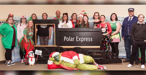 Helping host the accountability courts Christmas party were, from left, Christina Mosley, Nichole Panter, Kenzie Williams, Jodi Graves, Julie Panter, Chris Holt, Lindsey Ray, Michelle Green, Brandy Hamby, Courtney Pettit, Stephanie Bradford, Jennifer Dawson,Alyssa Dorman, John Arp, Noah Gibson, and  Assistant District Attorney Jefferson Adams as the Grinch.