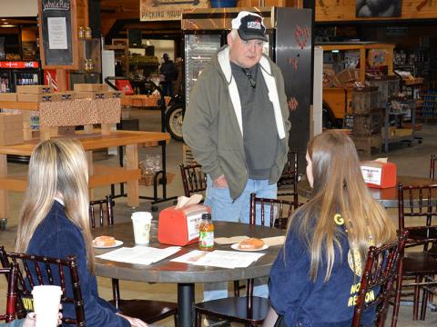 Tim Mercier, standing, welcomed the crowd to Mercier Orchards for the FFA sponsored Blessing of the Seeds & Farms, Gardens, Fields & Herbs