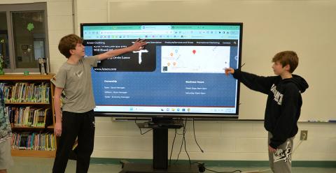 Ryan Wood, left, and Ryder Hanson presented their business plan for Amen Clothing, a Christian based clothing company, to the Fannin County Middle School Shark Tank judges.