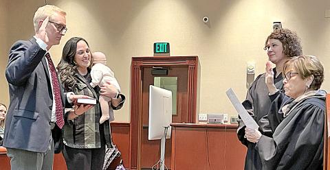 Frank Wood was sworn in as district attorney for the Appalachian Judicial Circuit by Chief Superior Court Judge Brenda Weaver and his wife,Kali, daughter, Madilyn, and Superior Court Judge B. Alison Sosebee watch.
