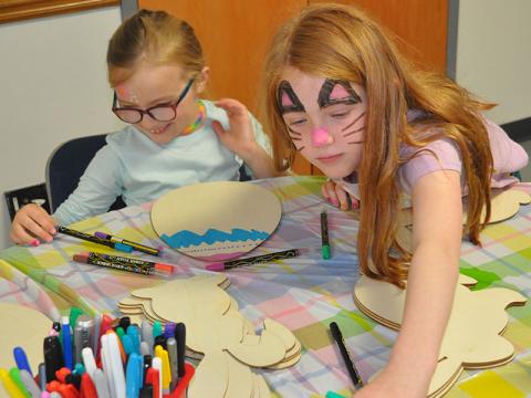 At Epworth First Baptist’s Easter Extravaganza, Sarah Burns Brown, left, and Ruby Dyer made beautiful works of art at the coloring station.