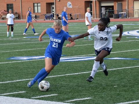 Shown following the 4-3 victory are, from left, front, Caroline Young, Emma Richardson, Bridgett Allen, Stephanie Kirk, and Shaylee Jones; second row, GiGi Torres, Natalie Middleton, Eleanor Hodgson, Carmen Alvarez Perguero,  Reese Lewis, Avi Ethington, Jayda Foster, Nadia Rosas-Leal, and Jordan Golden; and back row, Coach Jessen, Grace Fay, Harper Foster, Lacole Moler, Kinsley Pickelsimer, Olivia  Phillips, Annaleigh Cheatham, Delmy Saqui-Sacul, Karmah Eaton, and Coach Deal.