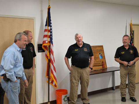 Fannin County Sheriff Dane Kirby, left, shared a story about Robert Graham’s early days that got a laugh from new Emergency Management Agency Director Patrick Cooke and Graham. Not surprisingly, Graham later denied the story was true.