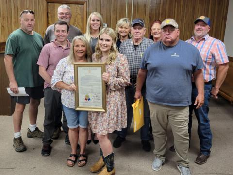 The Polk County commission honored Zoie Hatcher for her state championship in agribusiness. Shown with her are commissioners John Pippenger, Keith Barker, Danny Carver, Debbie Davis, Samantha Trantham, Hatcher, Kelley Morgan, Mush Davis, Christy Hardin, Greg Brooks and County Executive Robby Hatcher.