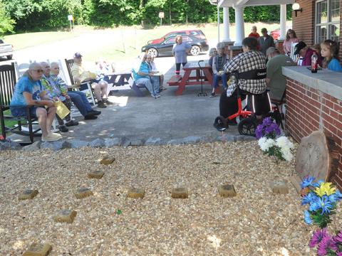 Several members of the Senior Center gathered on the patio area to honor those who have passed. 