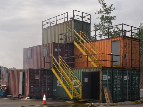 The Fannin County Fire Department’s burn building, constructed of used shipping containers, offers firefighters real world experience at battling a fire. Various scenarios can be created inside the building for students to overcome.