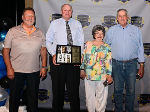 The 1942-43 Blue Ridge boys basketball team was inducted into the Fannin County Sports Hall of Fame this year. Children and relatives of team members, from left, John Querry, representing his father Ed Querry; Johnny Farmer, for his father Junior Farmer; Marie McGill Herndon, for her uncle Bill McGill; and Fred Jones Jr., for his father, attended the induction ceremony and accepted the plaque. Other team members were Jack Miller and Oliver LeMaster.