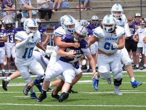 Noah Burnette (#88) wraps up a Gilmer ball carrier as Luke Holsonback (#11), Jacob Dye (#60), and Isaac Watkins move in for the assist.