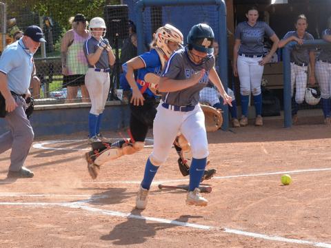 Megan Davis laid down a perfect bunt to get on base for the Lady Rebels against the Towns County Lady Indians in softball action last Thursday. 