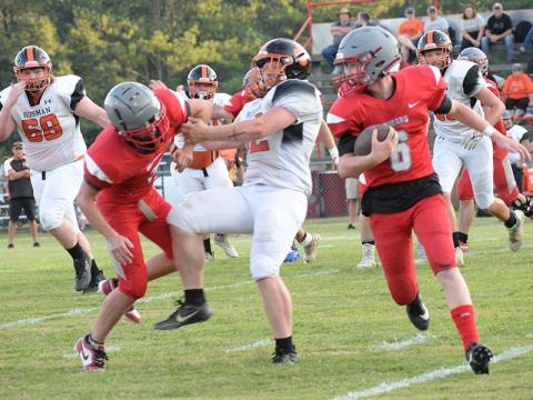 Copper Basin’s Drew Crowder (6) makes his way around the Rosman defense Friday night in the Cougars’ second scrimmage of the season. 