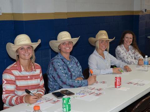 After showing off their barrel racing skills, these cowgirls took time to sign autographs for the many Special Olympic athletes and their friends at the rodeo preview Friday.