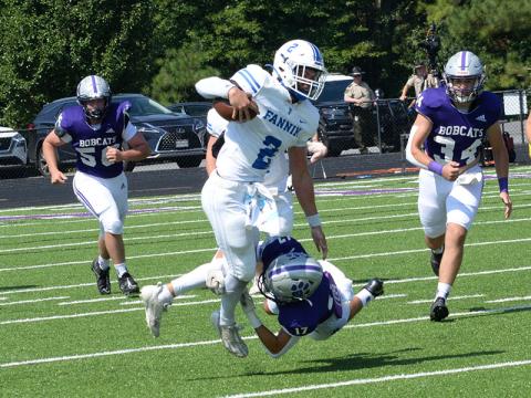Lawson Sullivan (#2) works to get away from a Gilmer defender in action Saturday morning in Ellijay. Sullivan gained 164 yards on six carries during the game.