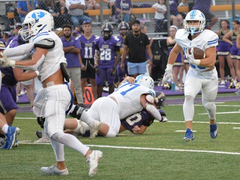 Braden Taylor sets the lead block after Jacob Green (77) makes a hole in the offensvie line for Carson Callihan to gain some of his 61 yards against the Union County Panthers Friday night in Blairsville.