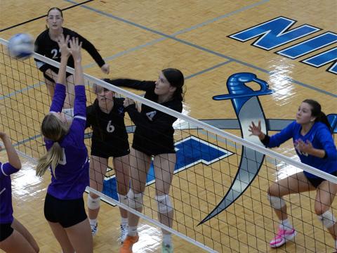 Fannin County’s Bailee Stiles (#4)  fires the ball back over the net in the Lady Rebels match against the Darlington School Tuesday, September 3. Fannin’s Ashlyn Jones (#6) and Karis Hurd (#22) assist in the action.
