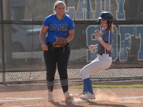 Makayla Stiles reaches third base safely for the Lady Rebels in action earlier this season. 