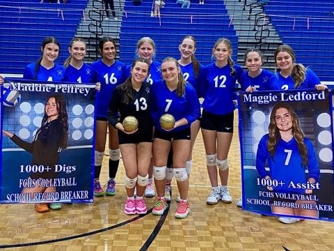 The Fannin County Lady Rebels volleyball team recently celebrated record setting performances by two of its own, Maddie Pelfrey and Maggie Ledford. Pelfrey, front at left, was honored for over 1,000 digs and Ledford, front at right, was recognized for over 1,000 assists.  Honoring their teammates are, back, from left, Bailee Stiles, Kaylie Davenport, Rylee King, Kendall Clore, Karis Hurd, Keslie Kea, Ashlyn Jones and Maya Butler.