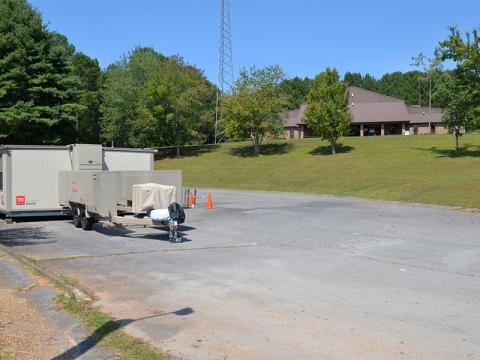 A portable building that will house the Polk County Health Department now sits in the lower parking lot below the Copper Basin Senior Center. County Executive Robby Hatcher said he is working on two more buildings, one of which has been confirmed, so that other services provided in the senior center can continue during repairs.