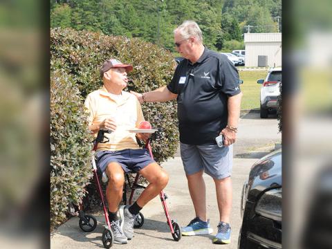 North Georgia Veterans Assistance Foundation Founder and Board Member Ken Brenneman, right, talks with Robert Foster after the ribbon cutting for the foundation.